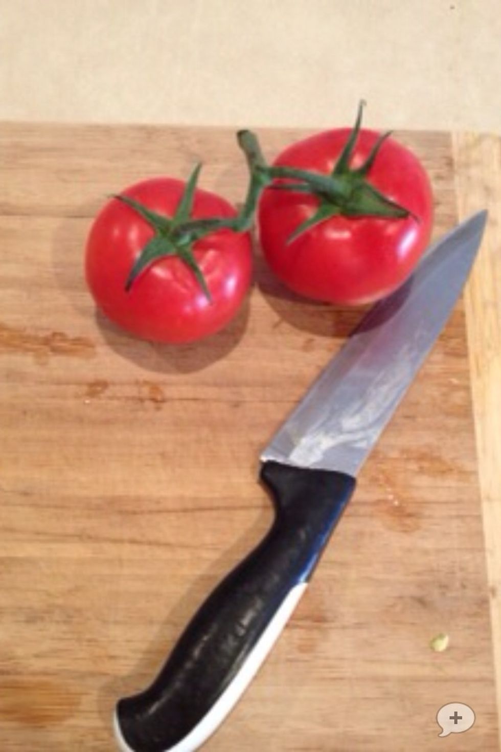 Chop 2 tomatos up