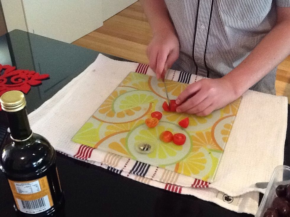 Chop 250g of cherry tomatoes