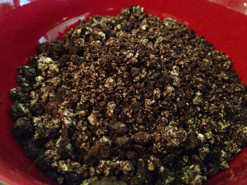 Chop 9 cookies into fine crumbs using food processor, reserve for later use. Chop the remaining 36 cookies into fine crumbs and place in medium bowl.