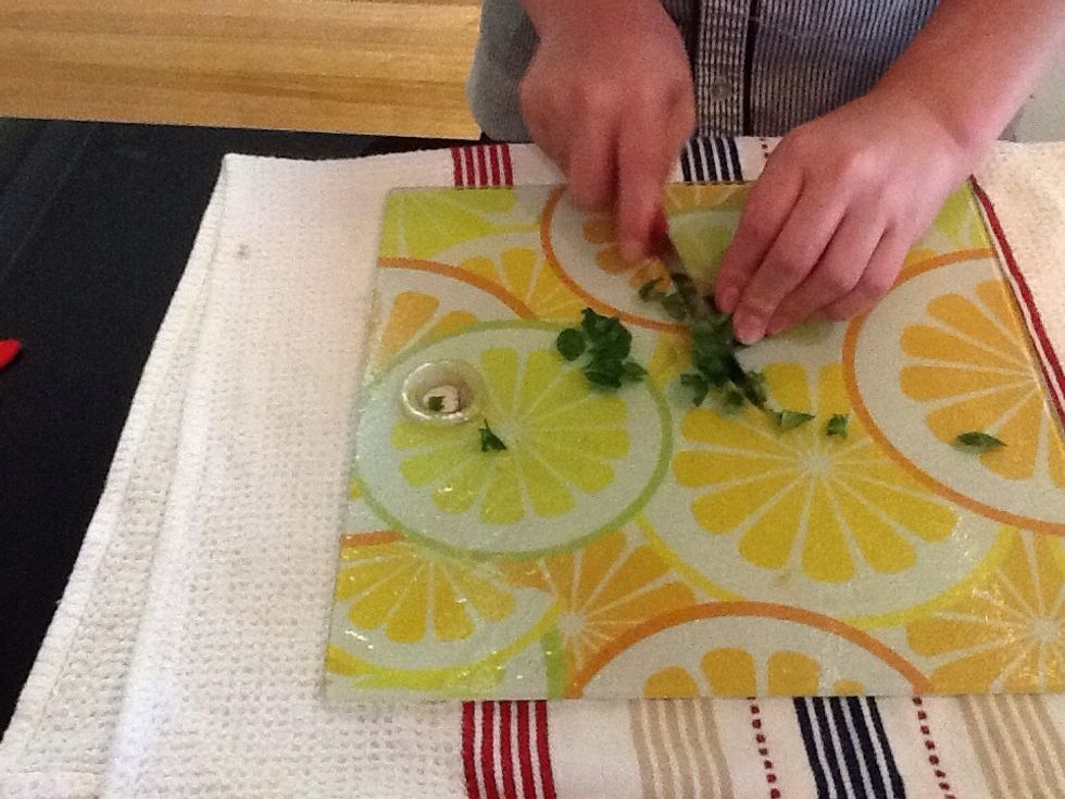 Chop a handful of basil leaves