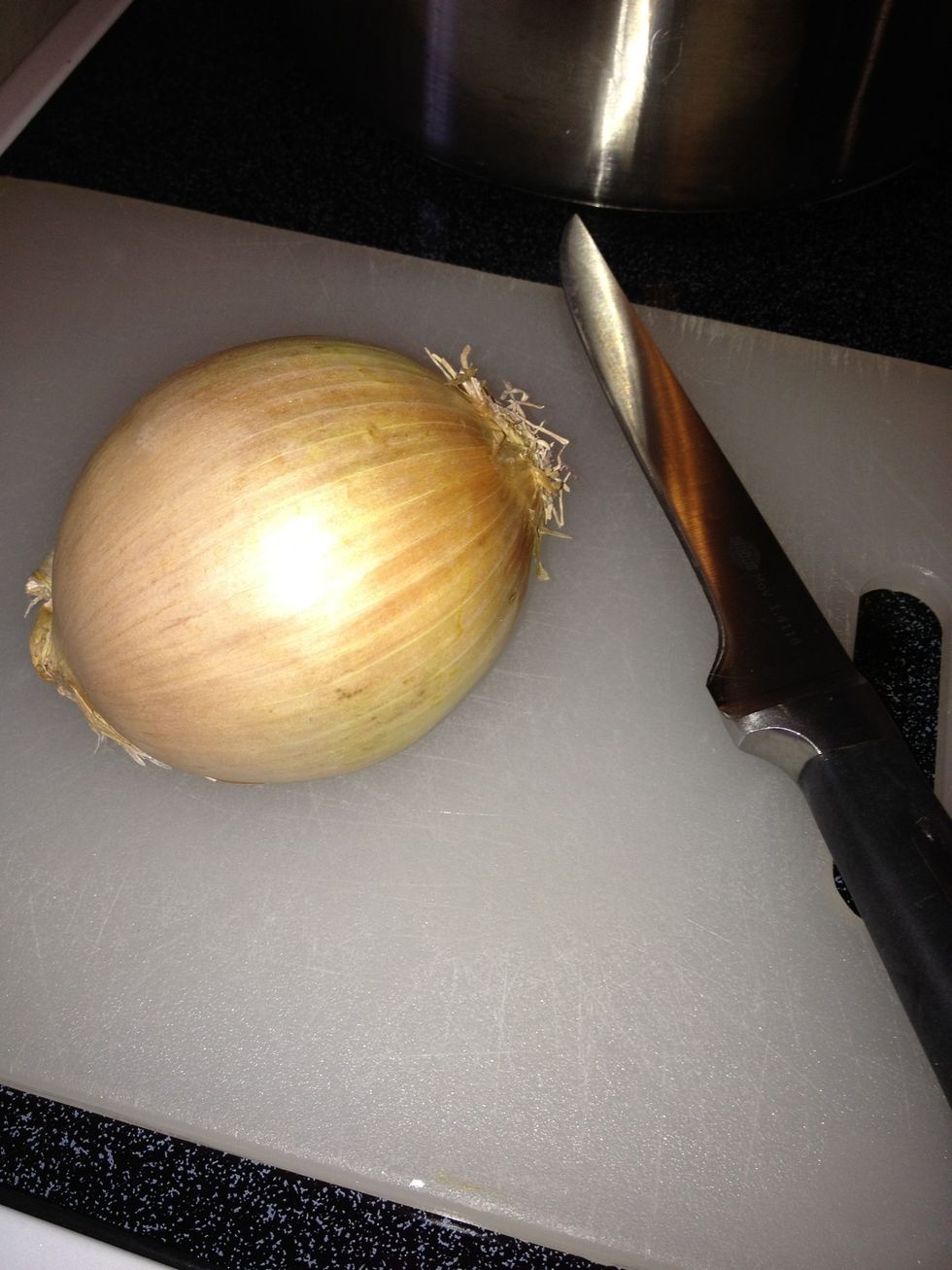 Chop a large onion...this is optional. I always add one to my meat while I'm browning the ground beef.