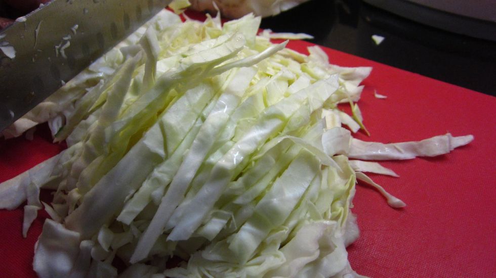 Chop a medium sized cabbage. Not too fine as the cabbage shrinks as it cooks.