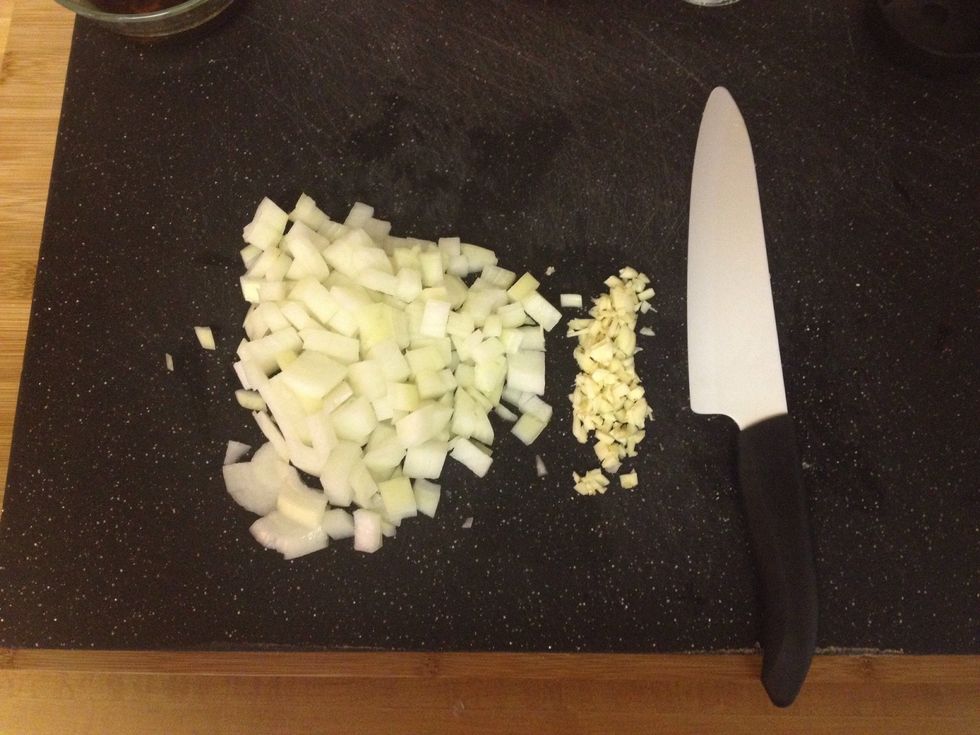 Chop a medium sized onion and mince 3-4 cloves of garlic.