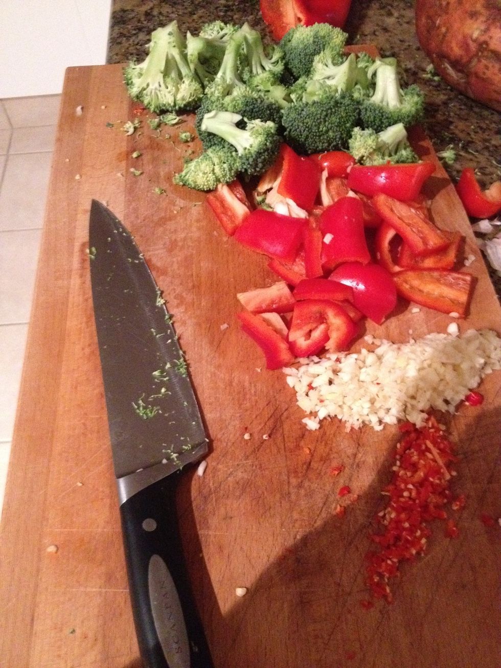 Chop all the vegetables whilst the sweet potatoes are boiling. Go nuts with chilli and garlic...as far as I'm concerned!