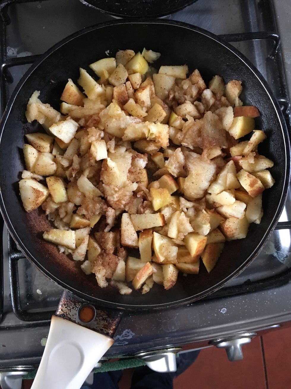 Chop an apple. Add the inside of the other apples. Add 1 tablespoon of brown sugar and 1 teaspoon of cinnamon. Put in a pot on the stove for 5 to 7 minutes