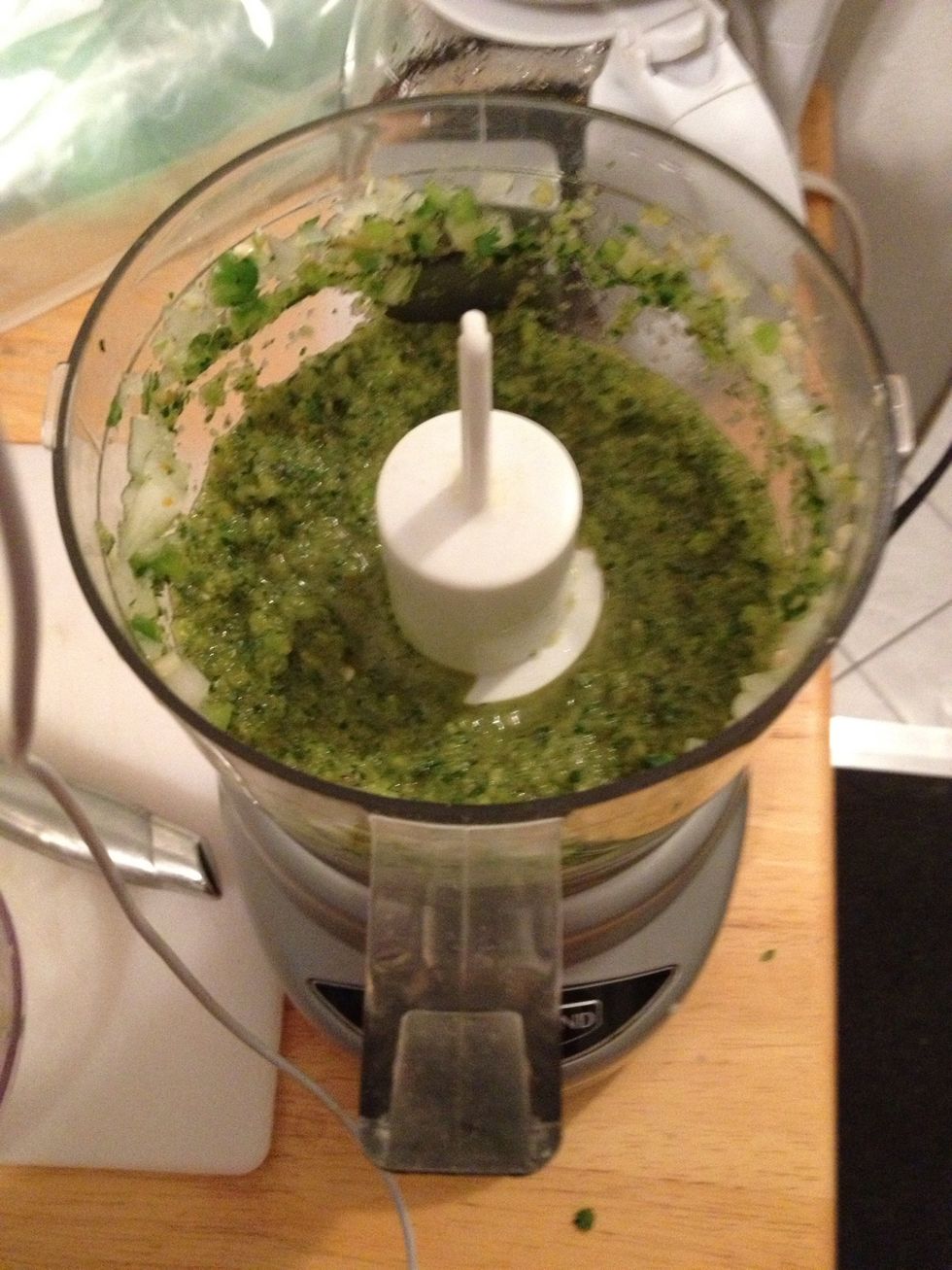 Chop and drop all seasonings ,and vegetables with olive oils in 3 cup food processor. Blend till chopped fine . (any left over mix place on ziplock bag and freeze great on chicken and fish as well.)