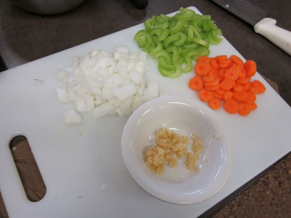 Chop and slice the onions, carrots, celery and garlic. Make sure you wash all the vegetables and peel the carrots.