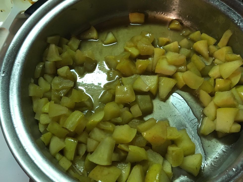 Chop apples. Add butter and apples to a skillet. Add 3/4 sugar, a dash of brown sugar, and cinnamon. Cook for about 5 minutes. Stirring occasionally