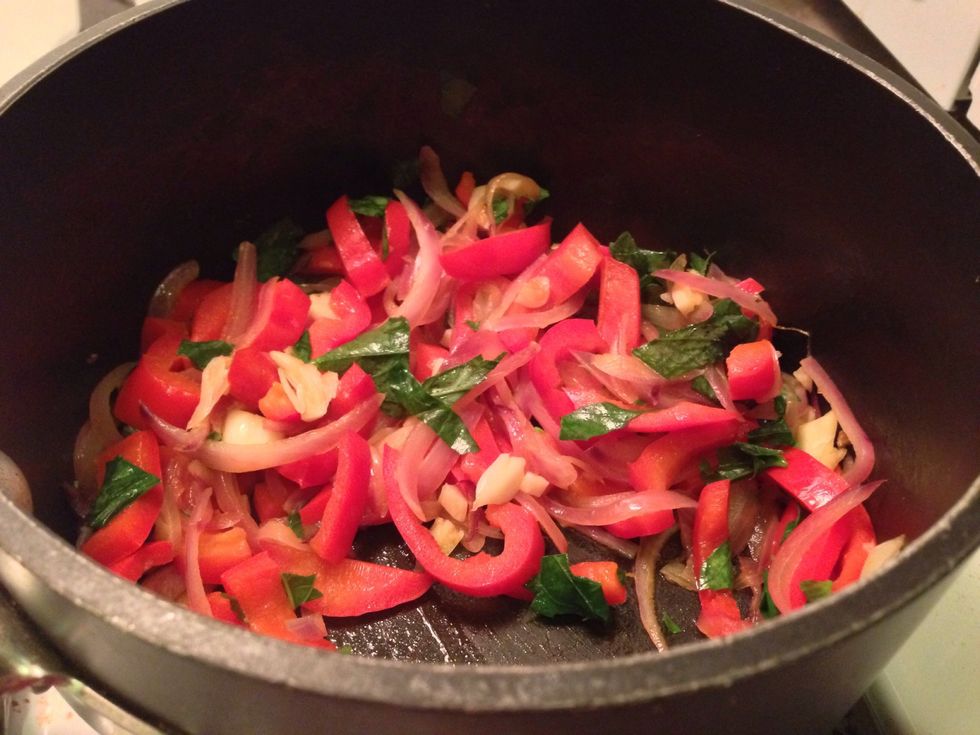 Chop basil, bell pepper, and onion. Crush garlic cloves and cut into parts. Saut\u00e9 with teaspoon of butter.