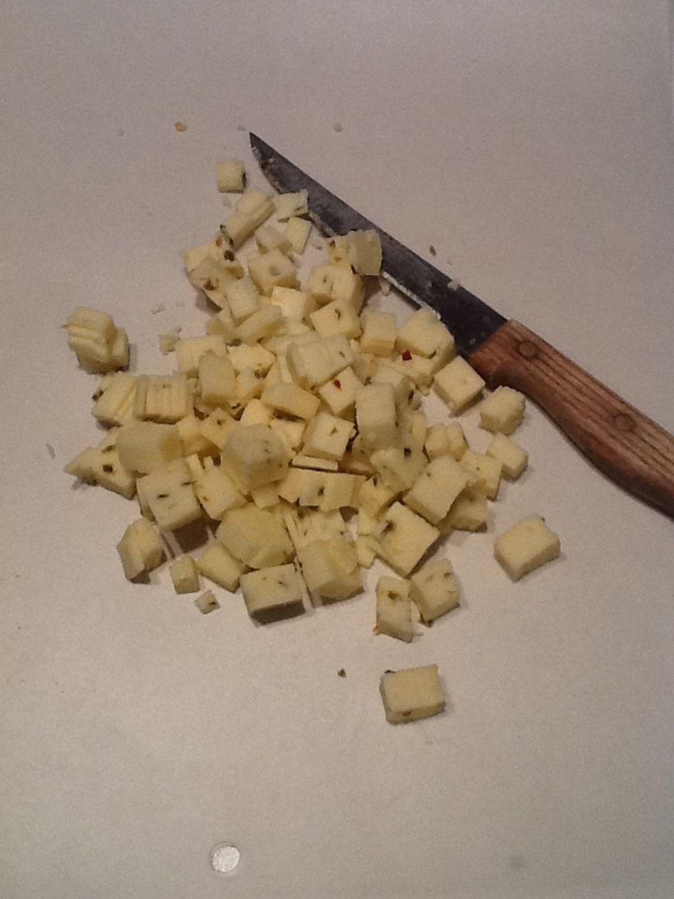 Chop cheese into small chunks. Shredded cheese can be used if preferred.