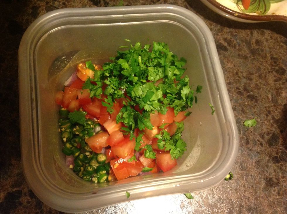 Chop cilantro and tomatoes, and add to a bowl with chiles and onions.