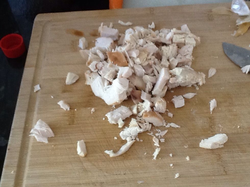 Chop cooked chicken into bite size pieces then put in a small bowl.