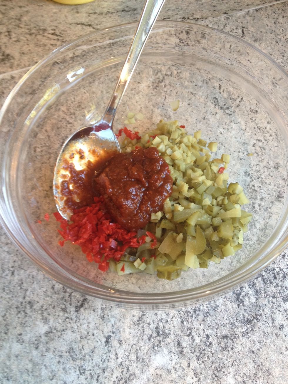 Chop cucumbers, cornichons and chili. Put it in a bowl and add the chipotle chili paste