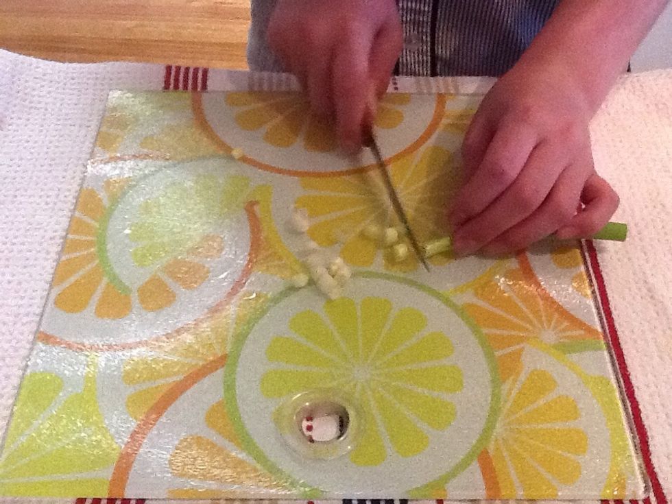 Chop five spring onions