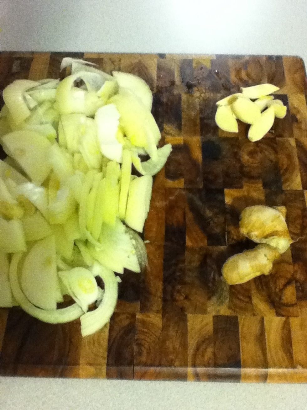 Chop four medium onions plus your garlic and ginger, a nice big pile of each.