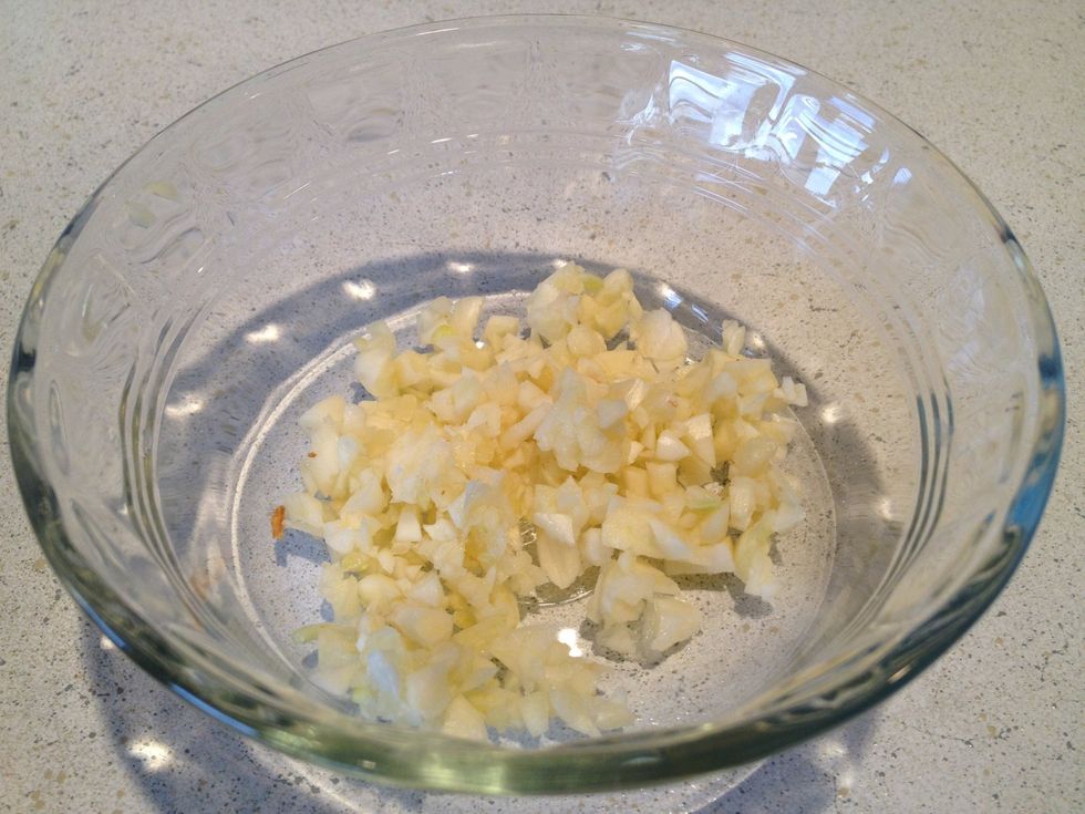 Chop garlic cloves to a small, uniform size.