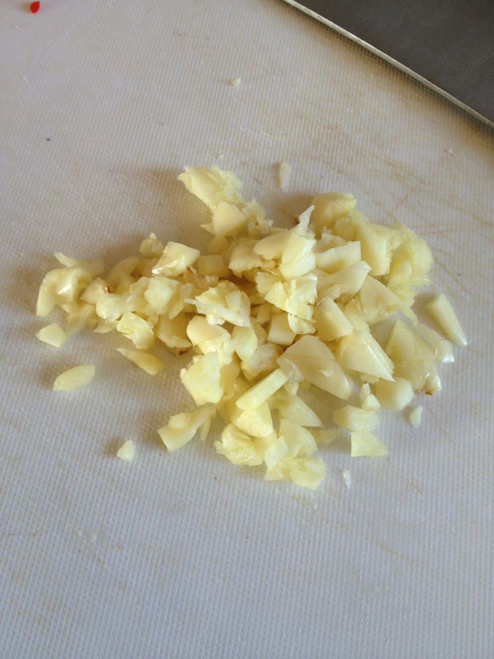 Chop garlic. Using 1/3 for frying broccoli and 2/3 for noodle