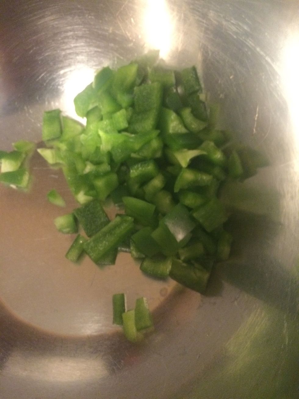 Chop green bell peppers and add to bowl