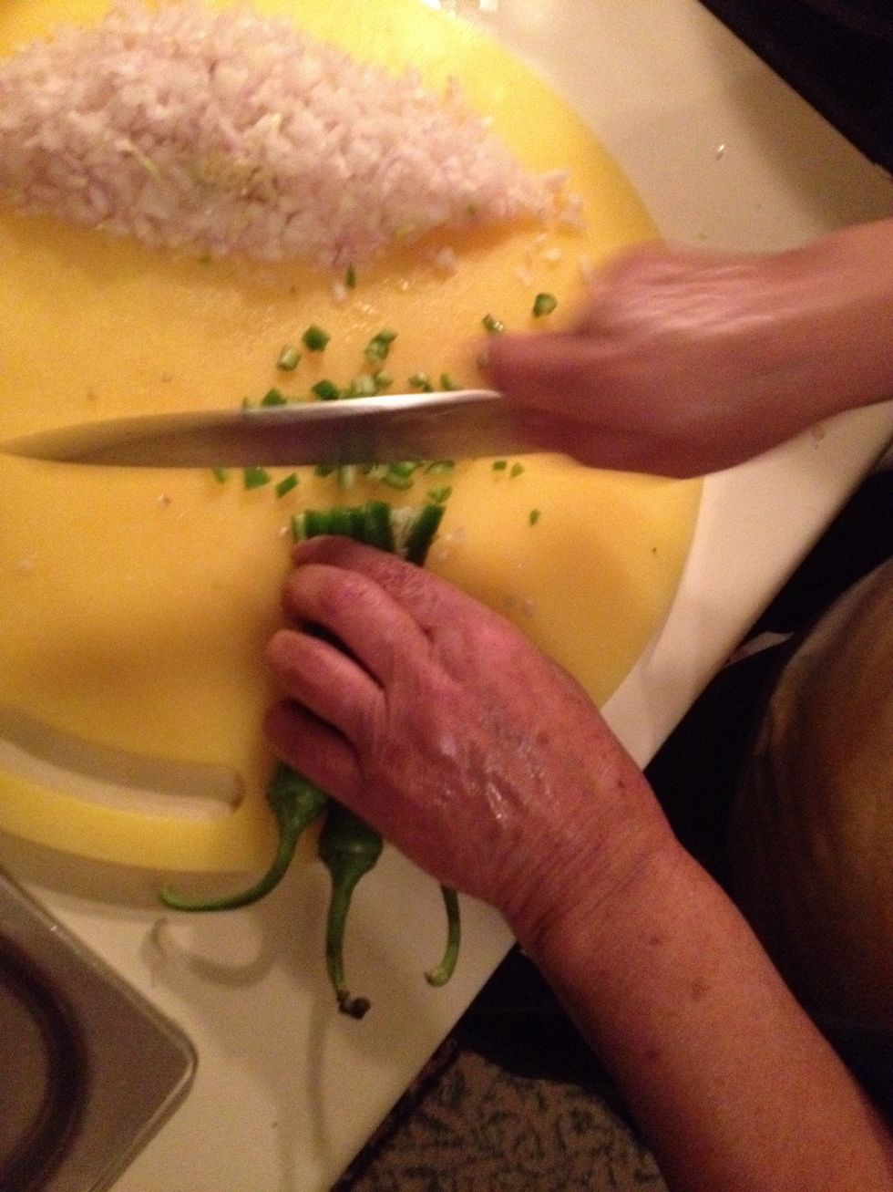 Chop green chiles. I have used Serrano chiles. You can use Anaheim or any other type depending on your tolerance for hotness.