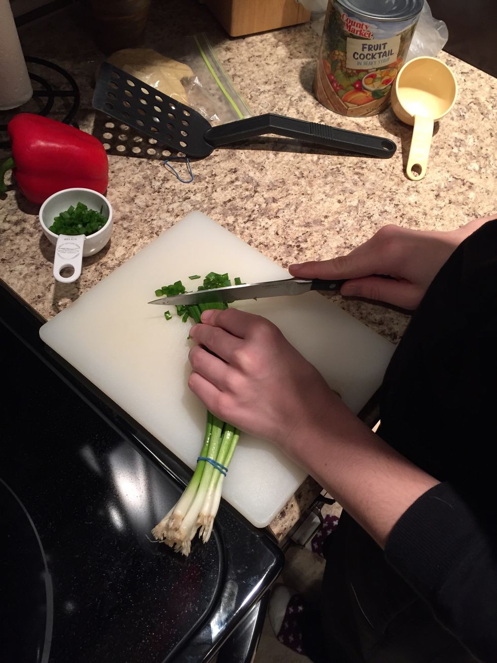 Chop green onions into small pieces