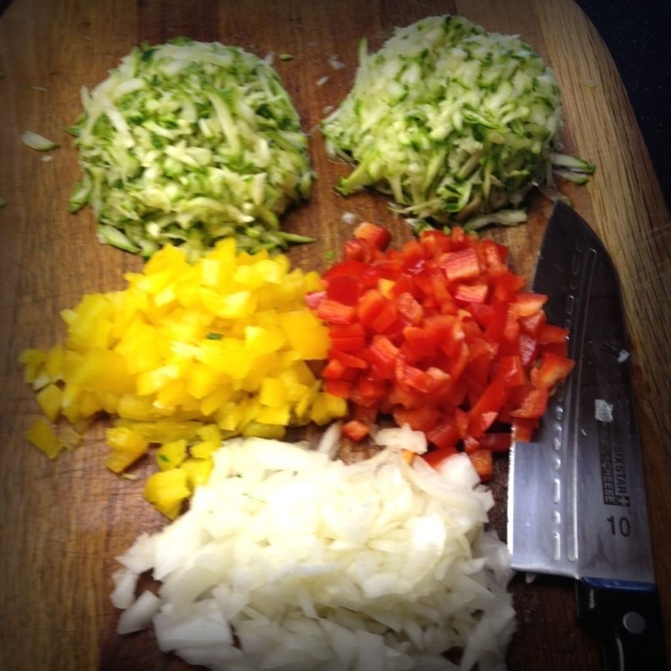Chop half of a yellow pepper, a red pepper and a yellow onion (half a cup each)