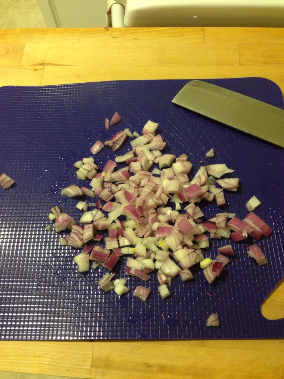 Chop half of an onion and add to a mixing bowl.