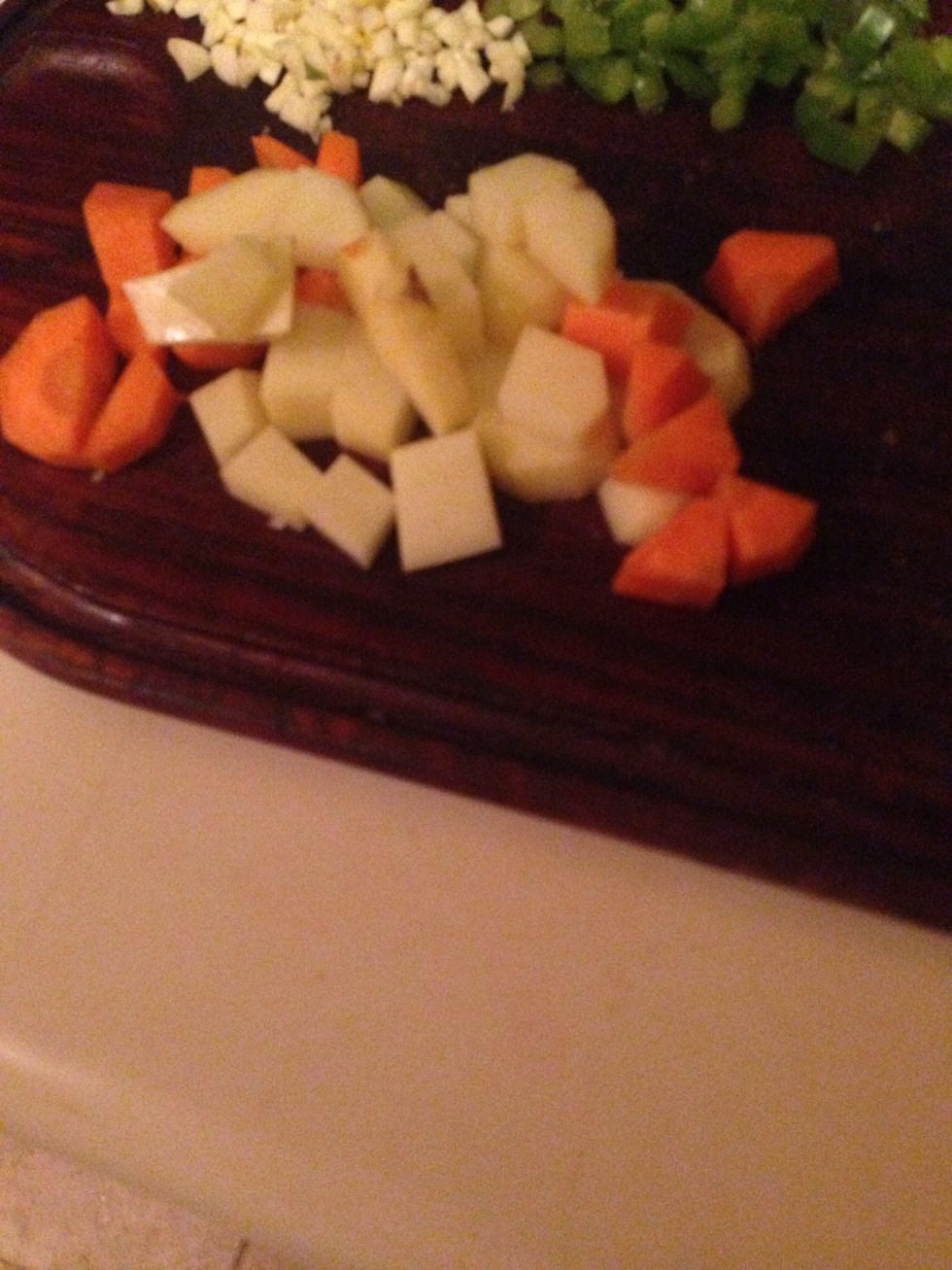 Chop in squares the potatoe And the carrot if you choose to use it