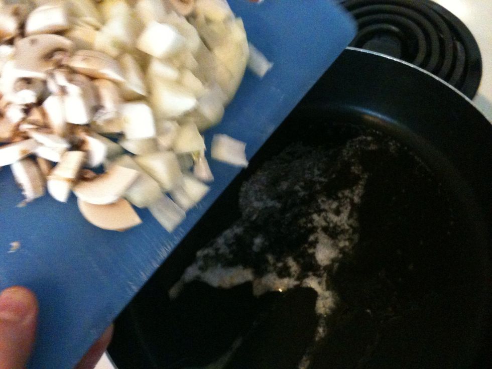 Chop mushrooms and onions . Fry them with 2 tsp butter in a pan over medium heat. Stir occasionally for about 4 min. After the onions turn soft (4-5 min) stir in peas and cook another 4 min.