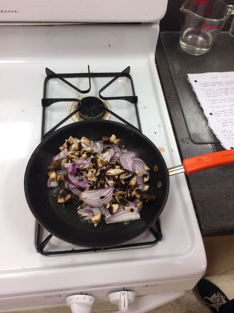 Chop mushrooms and then add both the onions and the mushrooms to the pan. Cook for 3-5 minutes