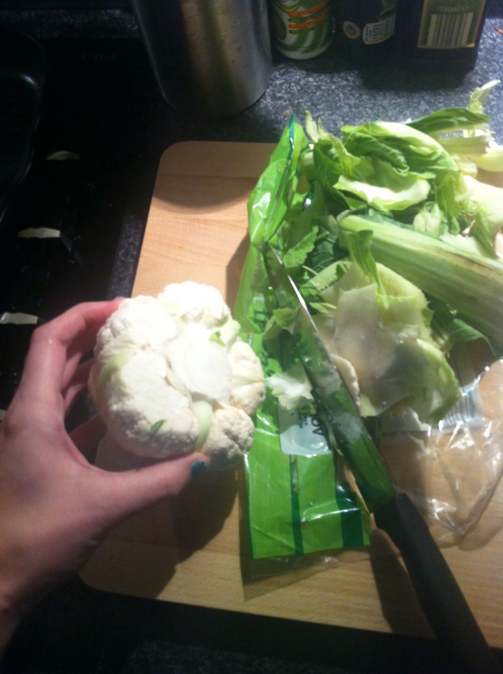 Chop of cauliflower end but ensure you have enough left to hold when grating.