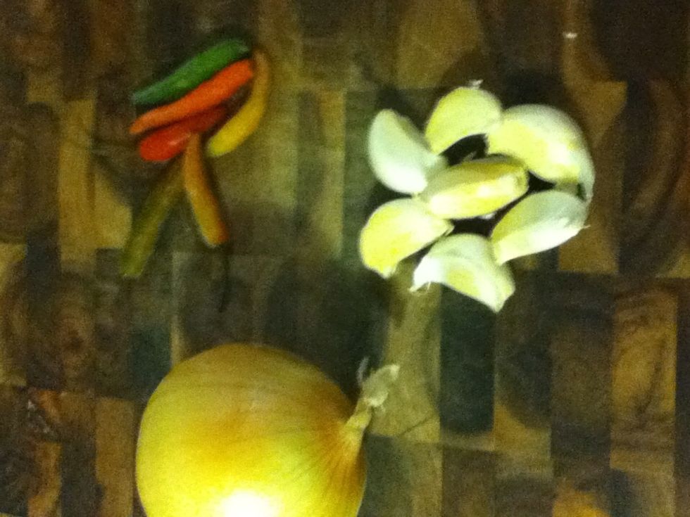 Chop one onion, the chilis and lotsa garlic. I've got six chilis here because we like these shrimp hot, hot, hot! These are the bar snack you're gonna make instead of Buffalo wings from now on!