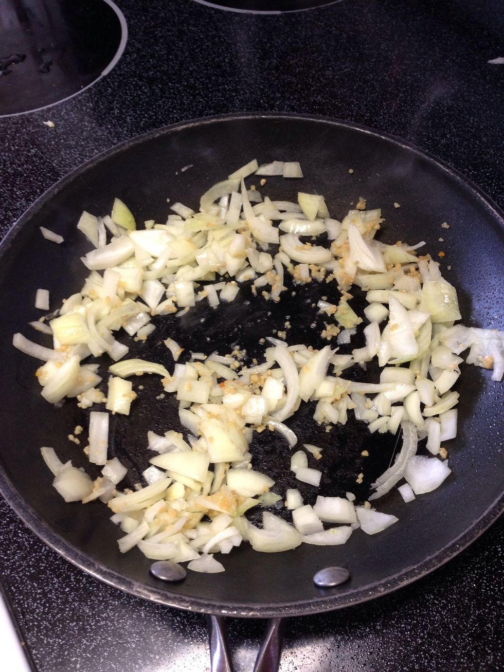 Chop onions and add to pan with minced garlic. Let onion soften and sizzle. about 3-5 minutes