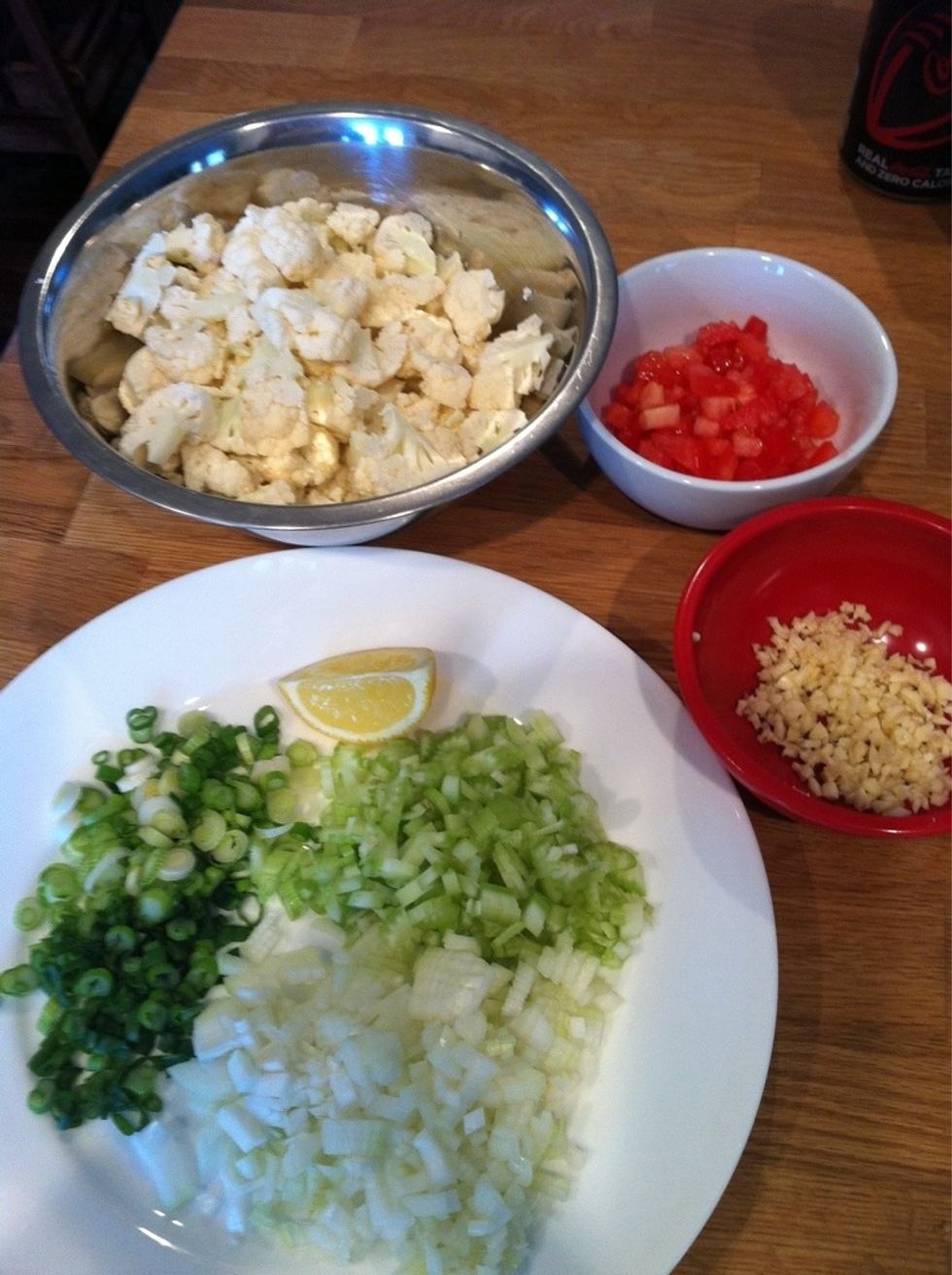 Chop onions, garlic, spring onions,celery, tomatoes and cauliflower.