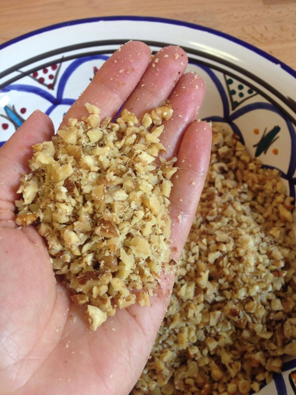 Chop (or place in a food processor) the walnuts into small pieces and place in a large mixing bowl. If using a processor, be careful not to process the walnuts too fine.