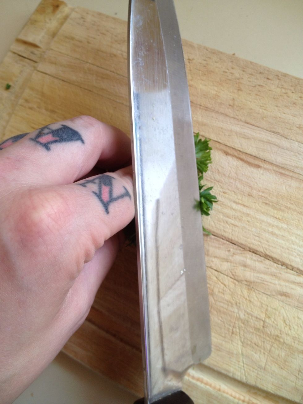 Chop parsley.