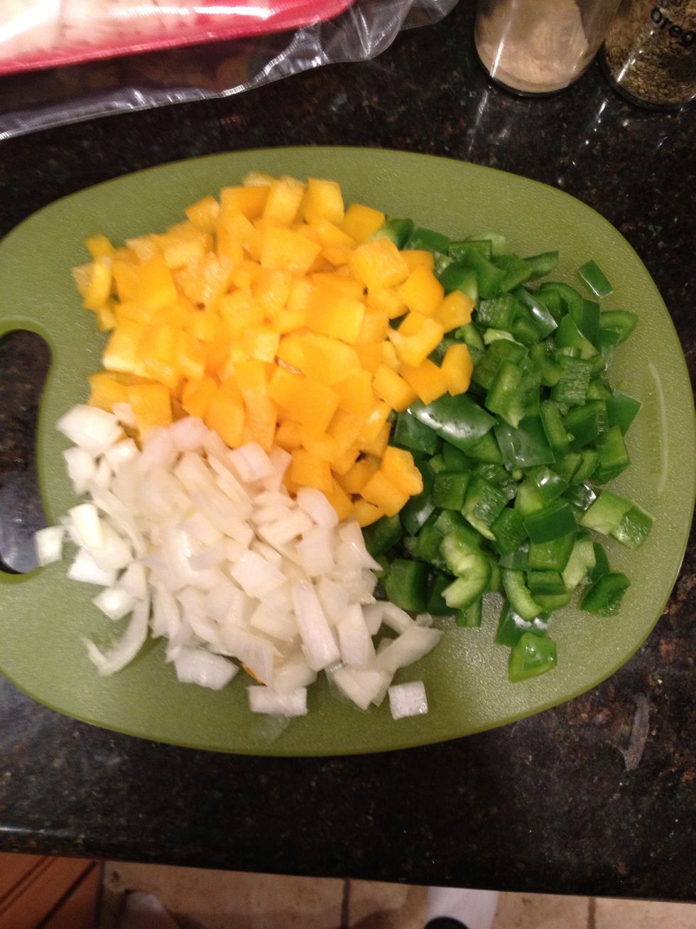 Chop peppers and onion. There was more onion but it was a small cutting board.