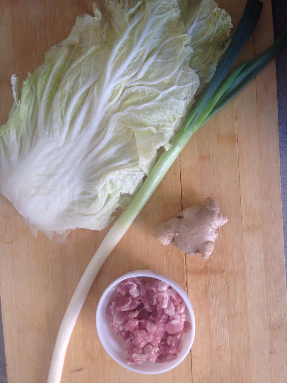Chop pork, spring onions, ginger and cabbage.