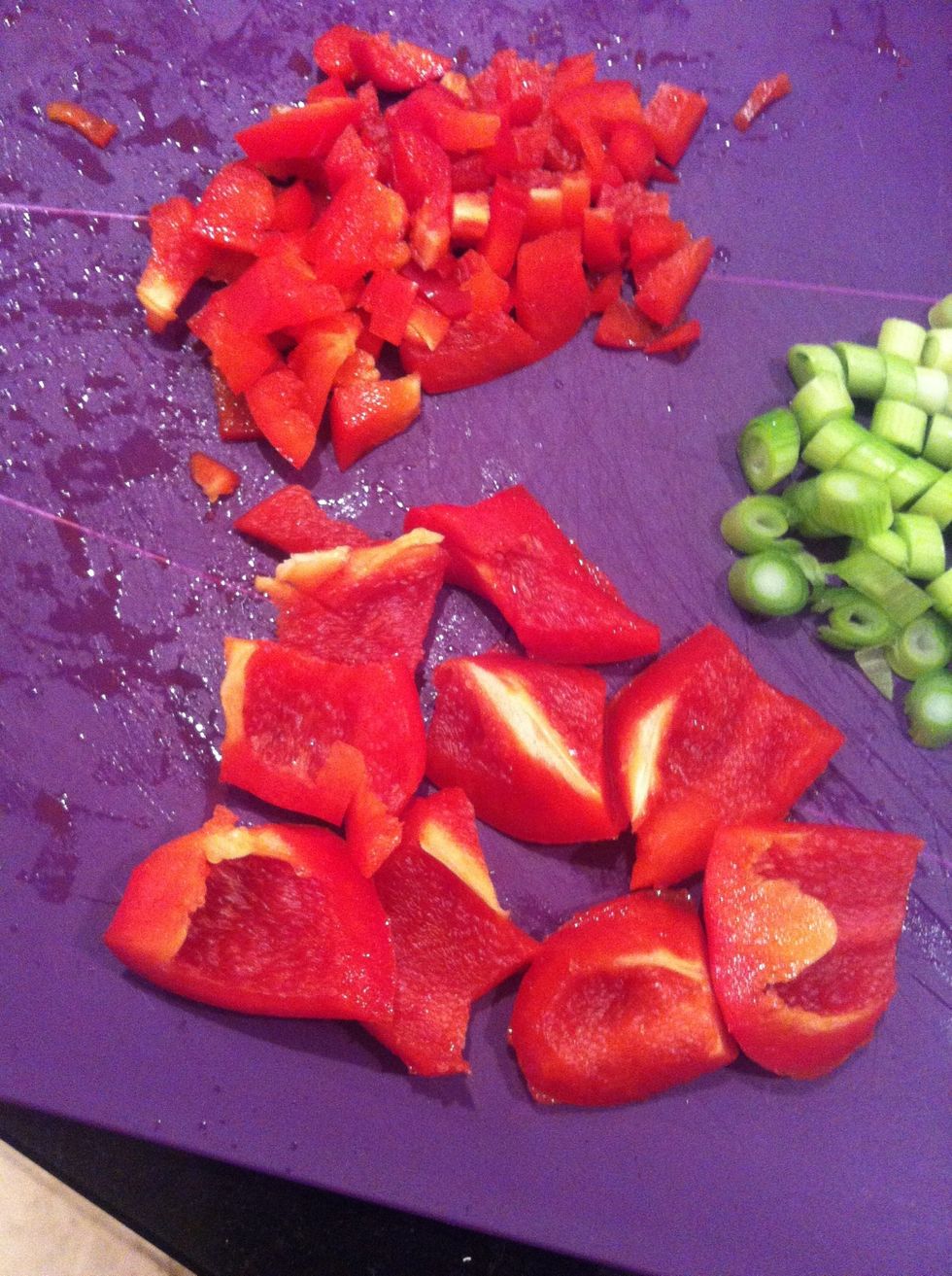 Chop red pepper into little bits and bigger circles for kebab ends