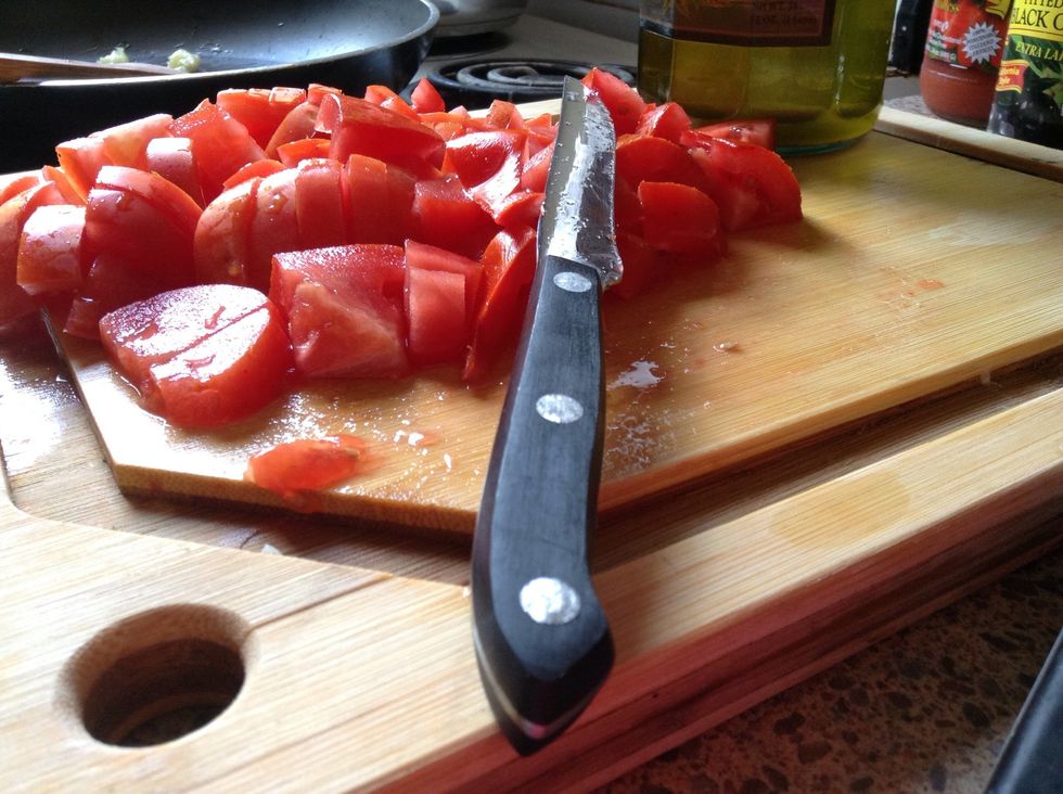 Chop rinsed tomatoes; do not worry about size or uniformity as you will be cooking them down into a sauce