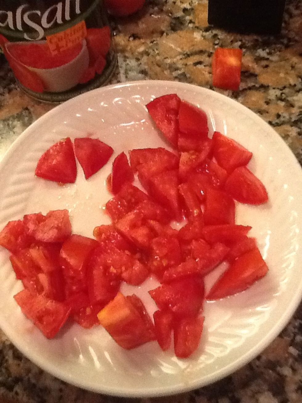 Chop some fresh tomatos in 1 cubes