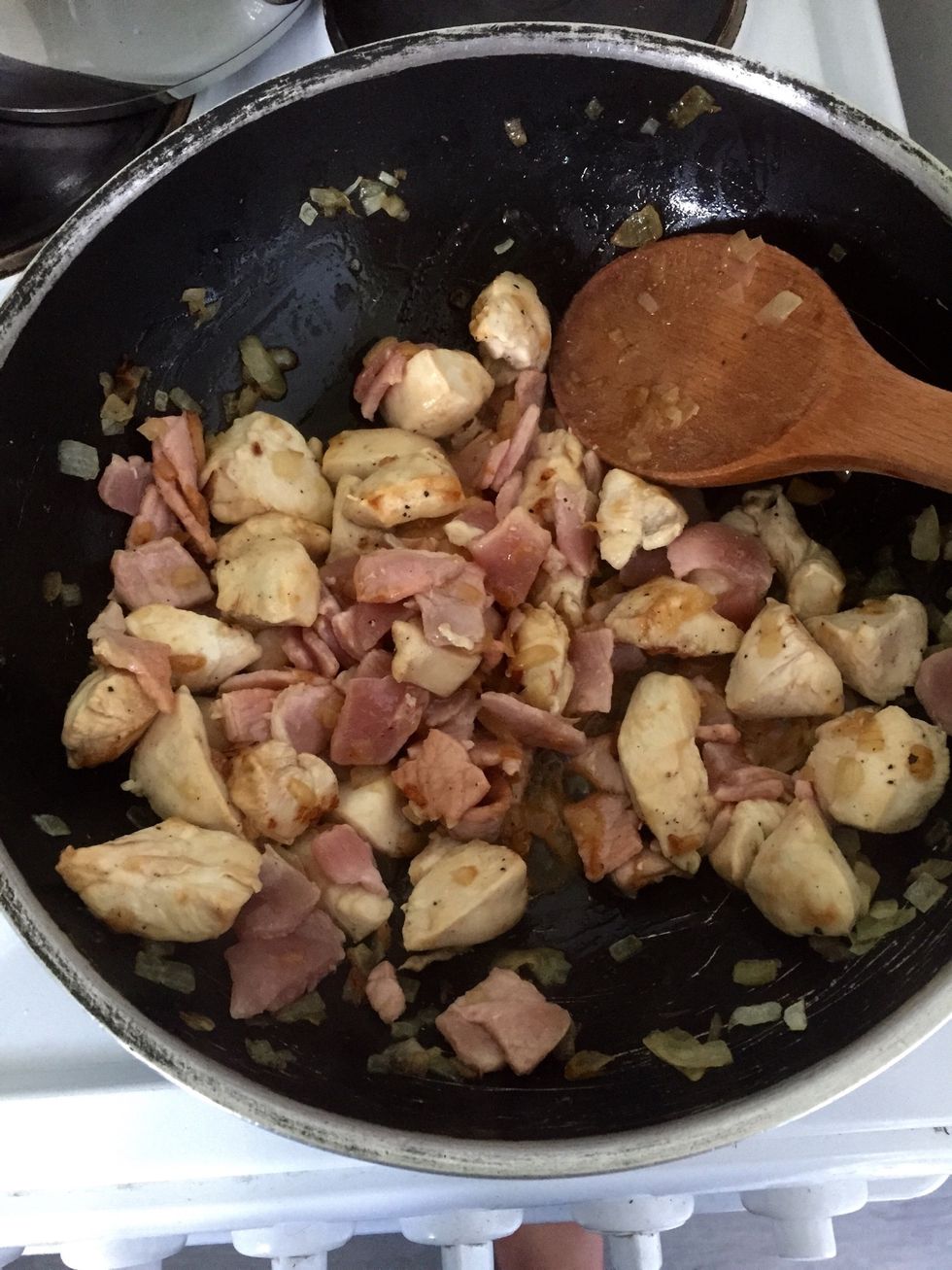 Chop the bacon and add when chicken is mostly cooked. Bacon is done very quickly