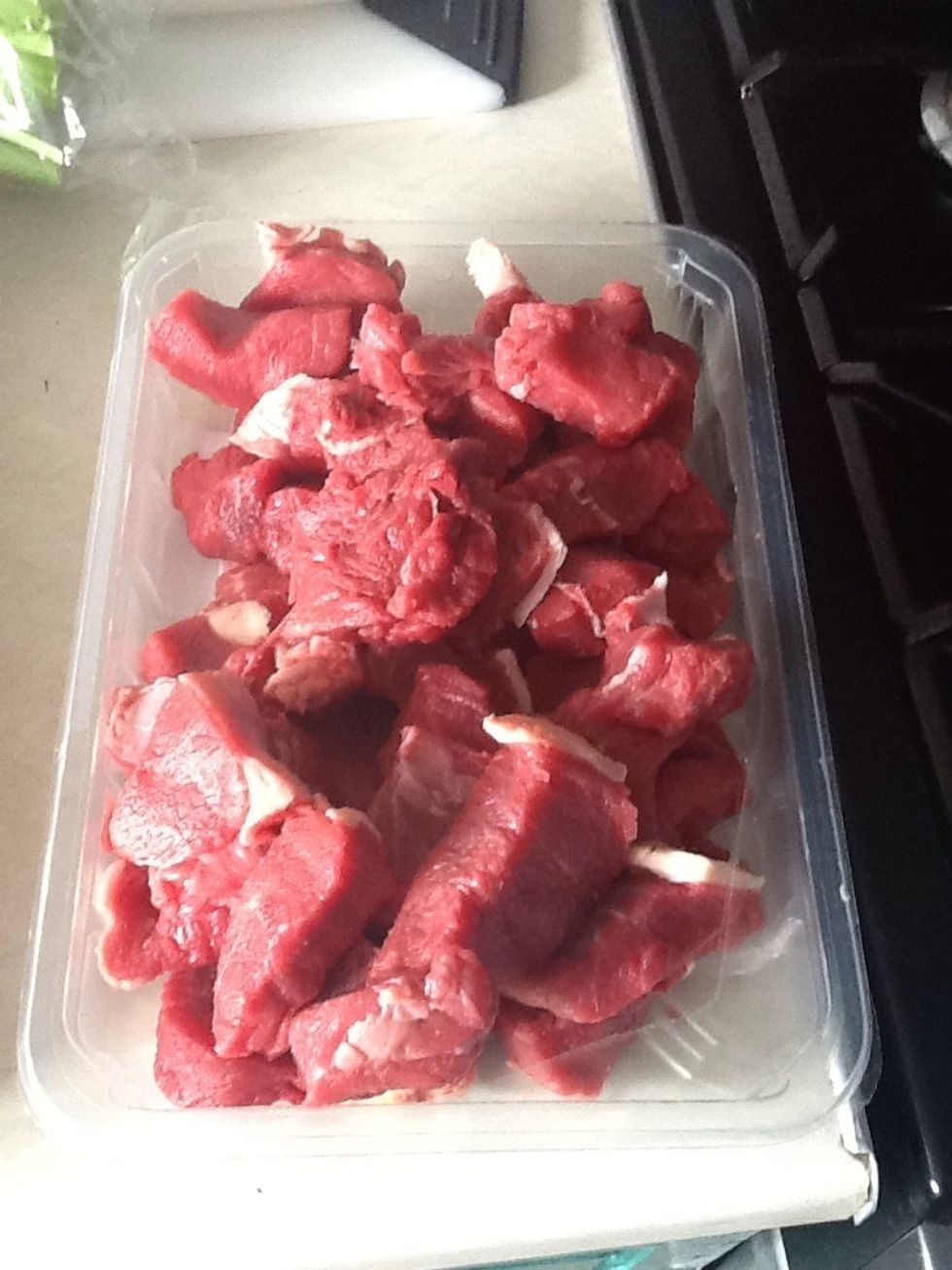 Chop the beef, coat the beef in the seasoned flour