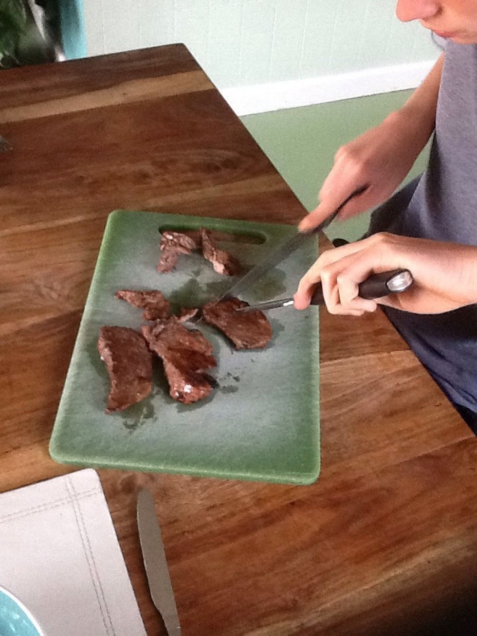 Chop the beef into smaller slices. This will go on top of the salad.