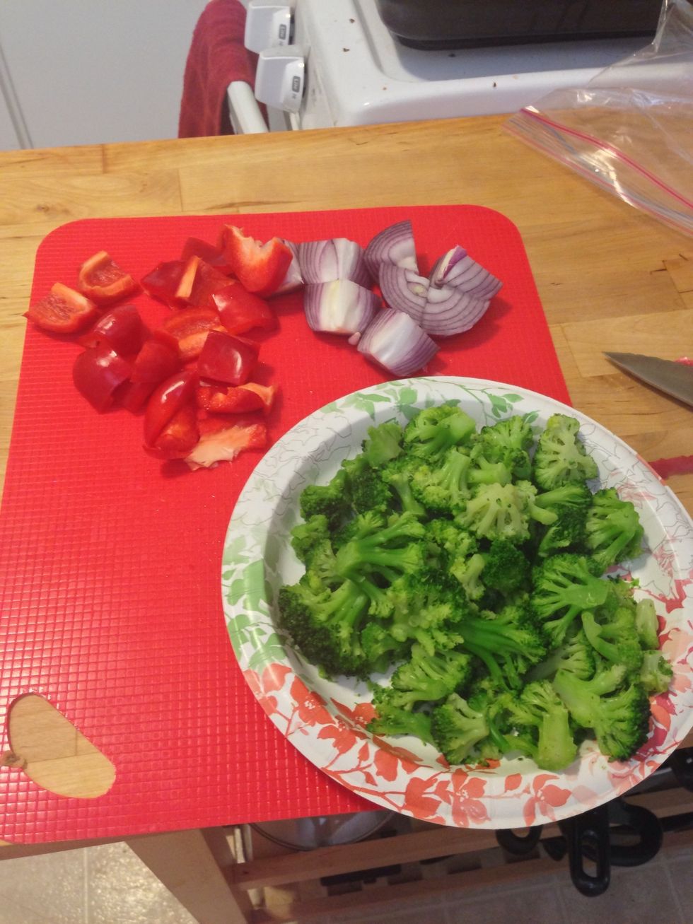 Chop the broccoli into florets and slice the 1/2 bell pepper and 1/2 onion into large chunks.