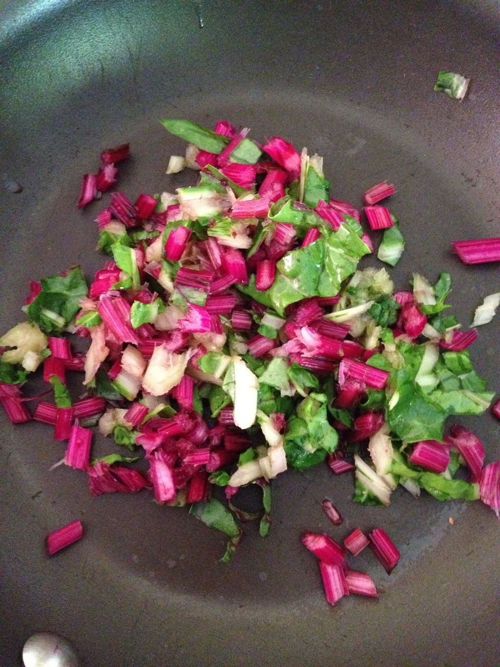 Chop the Chard stems & saut\u00e9 with some butter. Cook for a few minutes then add the onion. When onion is translucent , add the chopped leaves & chopped squash with a splash of water and cover.
