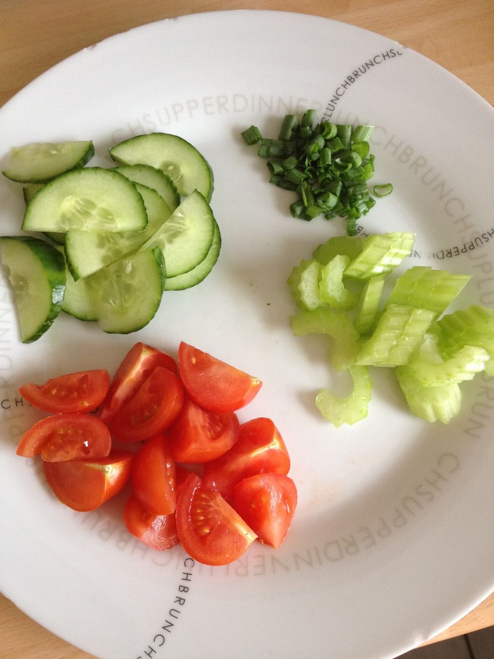Chop the cherry tomatoes, celery, spring onion and cucumber