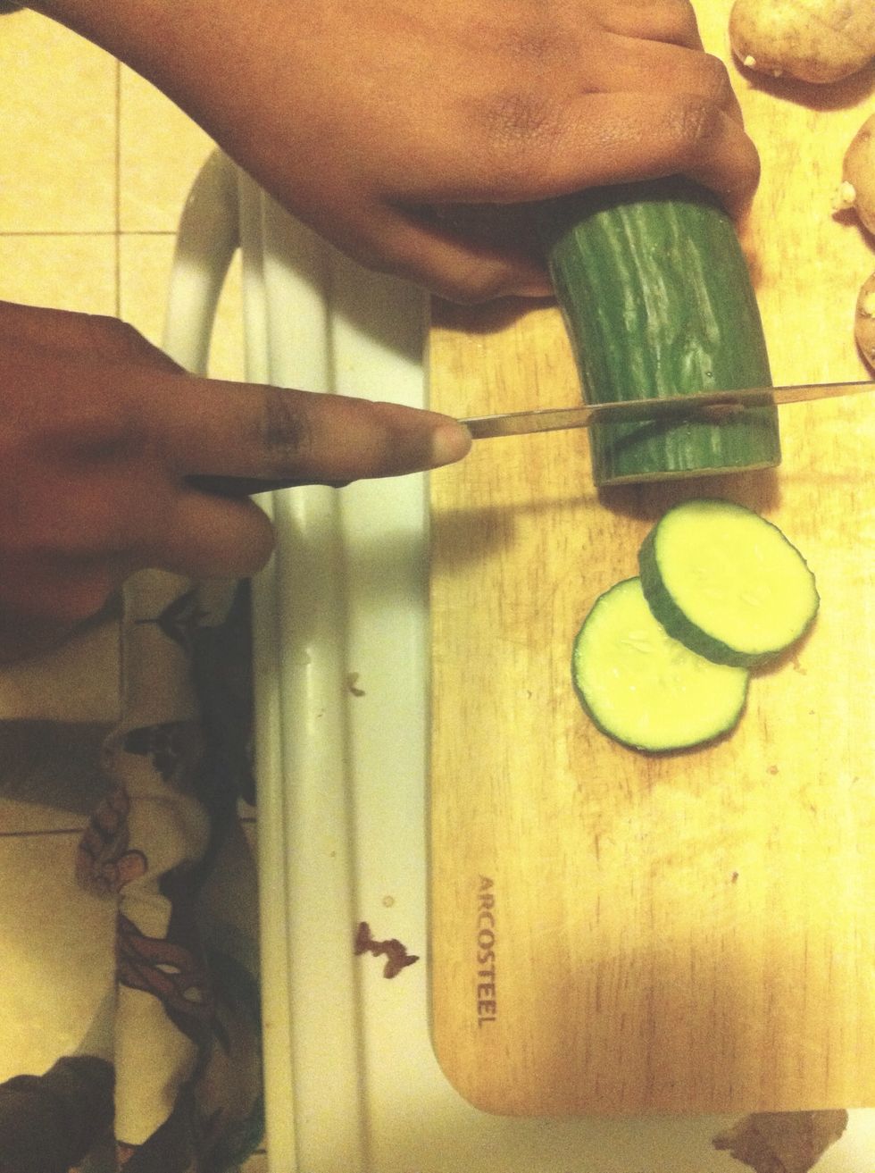 Chop the cucumber,Potatoes,red pepper and place in a medium sized bowl