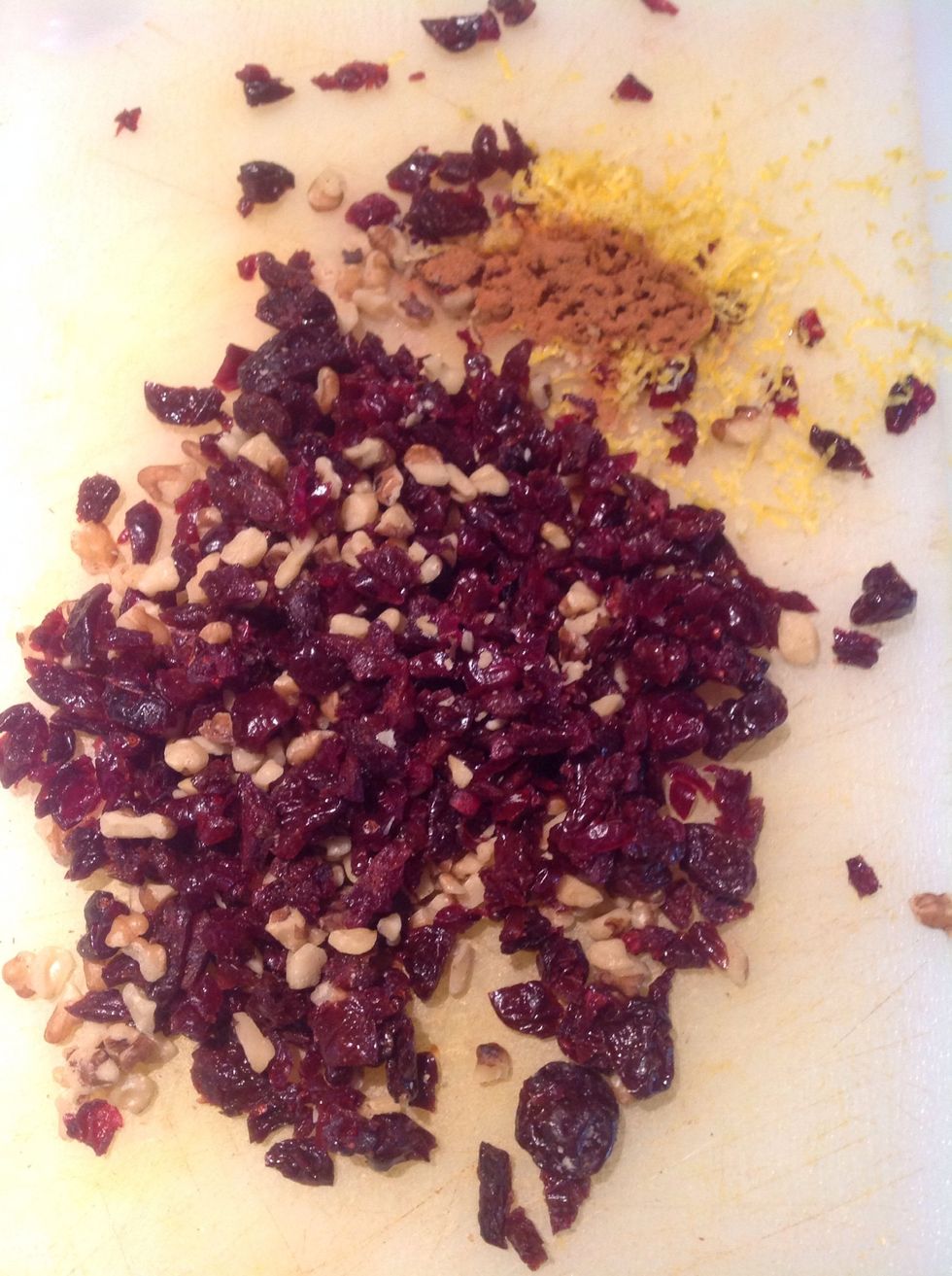 Chop the fruits and the nuts. Add the grated lemon rind and some cinamon