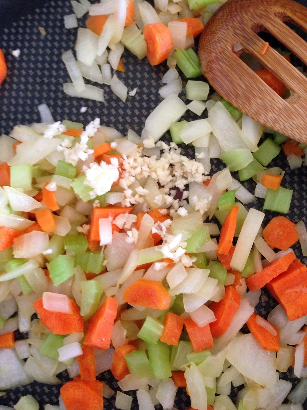 Chop the garlic and toss it in with the veggies. Cook for a few minutes until fragrant.