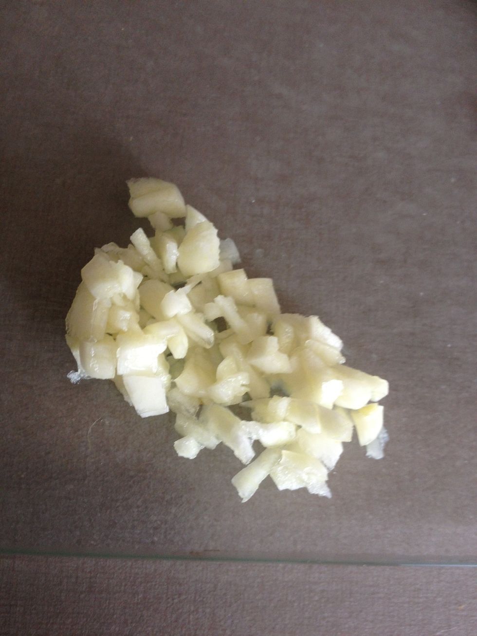 Chop the garlic finely. Or you can use a garlic crusher if you have one.